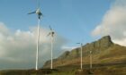 Community-owned wind turbines on the island of Eigg in Scotland.