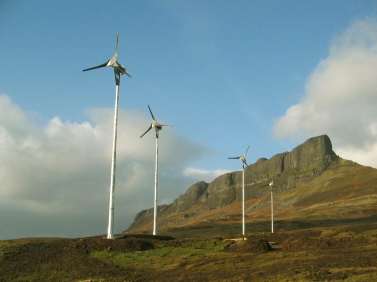 Community-owned wind turbines on the island of Eigg in Scotland.