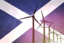 Wind turbines on the background of the flag Scotland