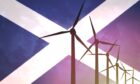 Wind turbines on the background of the flag Scotland