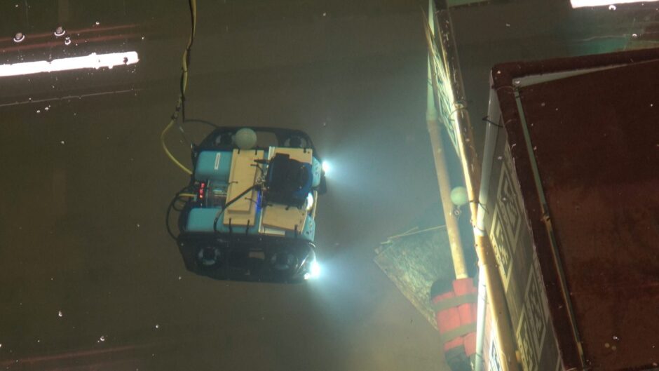 Autonomous underwater robot undergoing trials in Heriot-Watt University's wave tank facility.