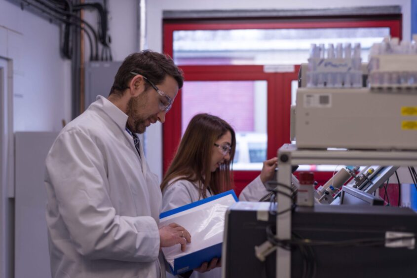 Dr Oleg Ishkov with PhD student Alsu Valiakhmetova at Heriot-Watt University lab in 2018.