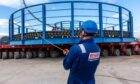 A Briggs Marine worker standing in front of one of Global Energy Group's subsea cable baskets.