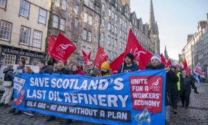 Members of the Unite union march and rally at the Scottish Parliament in protest at Petroineos plans to close Grangemouth oil refinery. Image: Jane Barlow/PA Wire