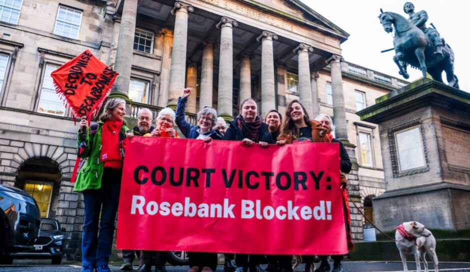 Climate campaigners celebrate outside the Court of Session in Edinburgh following a ruling overturning the approval of Equinor's Rosebank oil development in the North Sea.