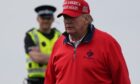 File photo dated 03/05/23 of US President elect Donald Trump playing golf at his Trump Turnberry course in South Ayrshire during his visit to the UK. Image: Andrew Milligan/PA Wire