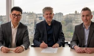 From left: Red Rock Renewables CEO Xiaomeng Chen; Inch Cape project director John Hill and ESB head of offshore wind, hydrogen and long-term storage Paul Lennon at the Inch Cape Edinburgh office signing the financial close deal.