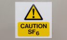 Caution Sulphur Hexafluoride sign on a grey background; Shutterstock ID 2152620845. Supplied by Shutterstock / J R Price.