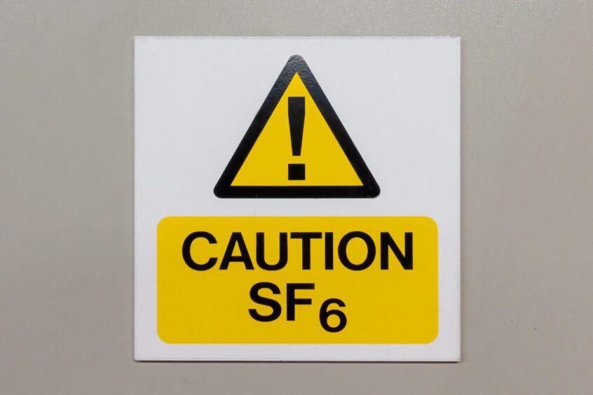 Caution Sulphur Hexafluoride sign on a grey background; Shutterstock ID 2152620845. Supplied by Shutterstock / J R Price.