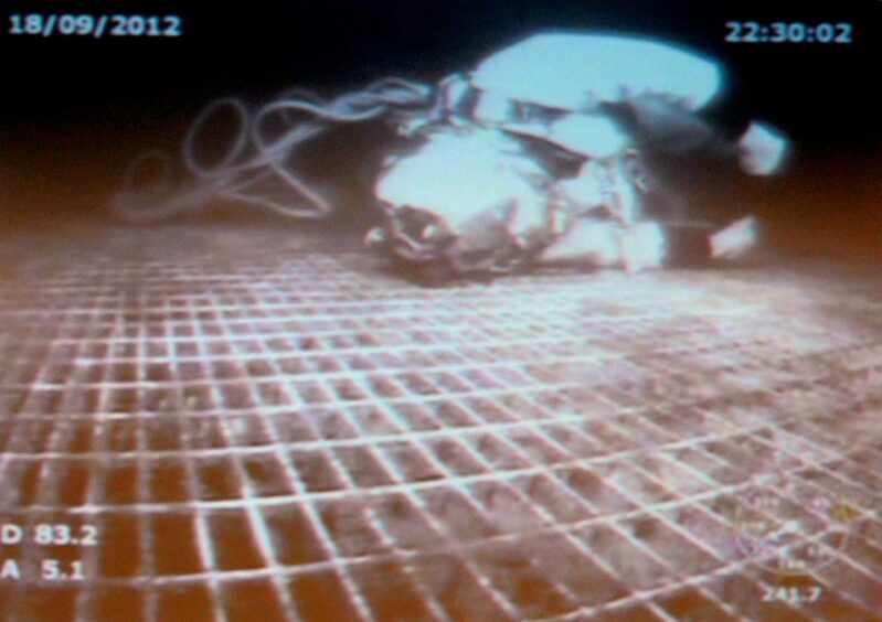 Diver Chris Lemmons lies helpless on the equipment he was working on, 300ft below the surface, after the diver support vessel changed position suddenly.