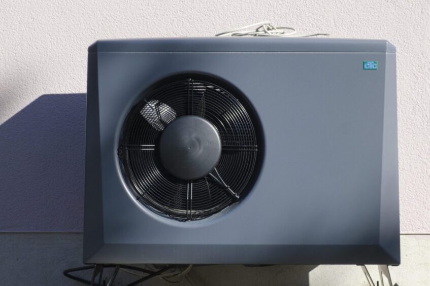 To go with story by Amy Smith. Heat pumps could be set for a revolution Picture shows; Heat pump in front of the house wall of a new building. N/A. Supplied by Wilfried Wirth/imageBROKER/Shutterstock Date; Unknown