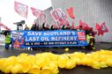 Members of Unite union take part in a demonstration to protest at Petroineos plans to close Grangemouth oil refinery, during the Scottish Labour Party conference at the Scottish Exhibition Centre (SEC) in Glasgow. Image: Andrew Milligan/PA Wire