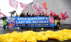 Members of Unite union take part in a demonstration to protest at Petroineos plans to close Grangemouth oil refinery, during the Scottish Labour Party conference at the Scottish Exhibition Centre (SEC) in Glasgow. Image: Andrew Milligan/PA Wire