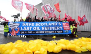 Members of Unite union take part in a demonstration to protest at Petroineos plans to close Grangemouth oil refinery, during the Scottish Labour Party conference at the Scottish Exhibition Centre (SEC) in Glasgow. Image: Andrew Milligan/PA Wire