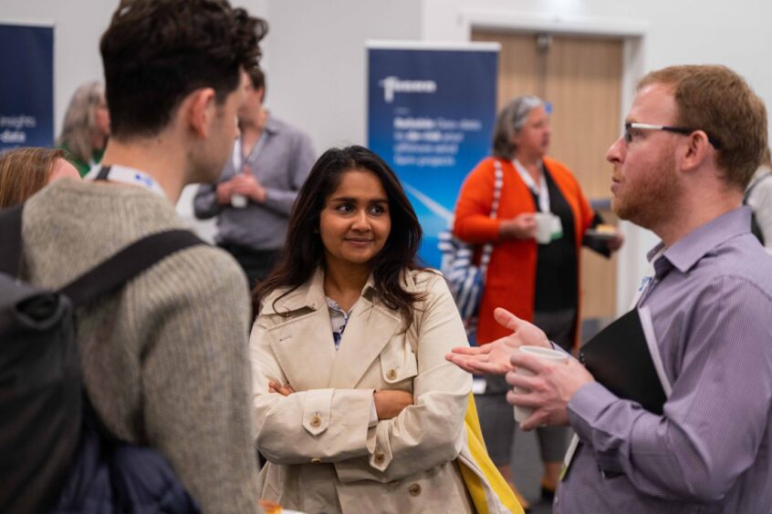 Attendees in discussion at the energy futures conference.