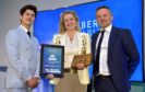 Camilla Carlbom Flinn is presented with the Humber Renewables Champion award in 2024, by Humber Marine & Renewables chair Iain Butterworth, right, joined by host Ben Hanlin.