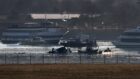 Recovery efforts following the collision between a US army Black Hawk helicopter and American Airlines Flight 5342.