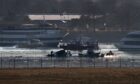 Recovery efforts following the collision between a US army Black Hawk helicopter and American Airlines Flight 5342.