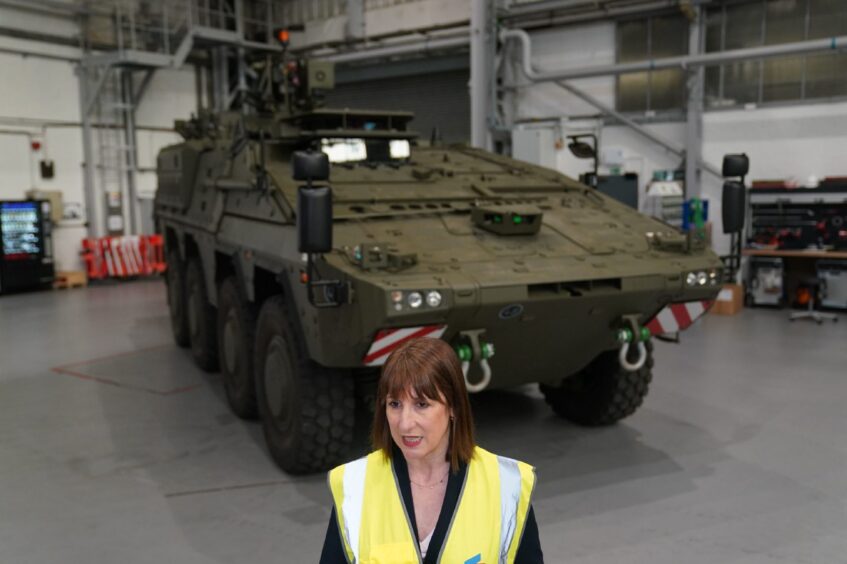 Chancellor of the Exchequer Rachel Reeves in front of a tank