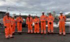 People at the Wormington Compressor Station in Gloucestershire, UK.