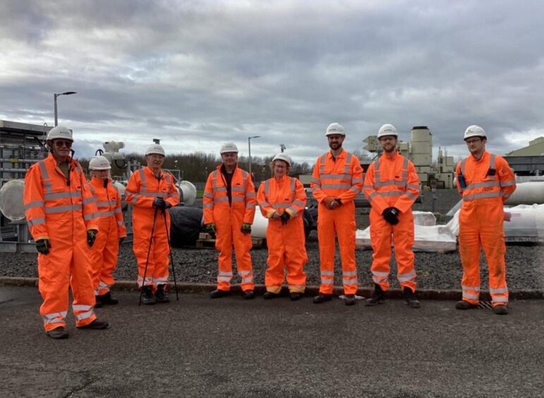 People at the Wormington Compressor Station in Gloucestershire, UK.