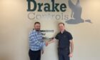Paul Stein (right) managing director of Score?s gas turbines division with Josh Gore (left), managing director of Drake Controls.