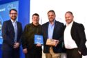 North Sea tanker collision responders celebrated at Humber awards. Windcat skipper Brian Smith, centre left, and fleet manager Dean Login, centre right, flanked by Nathan Kerins, right, and BBC News presenter Phillip Norton, left, with the Special Recognition Award for the response to the oil tanker collision in the Humber.