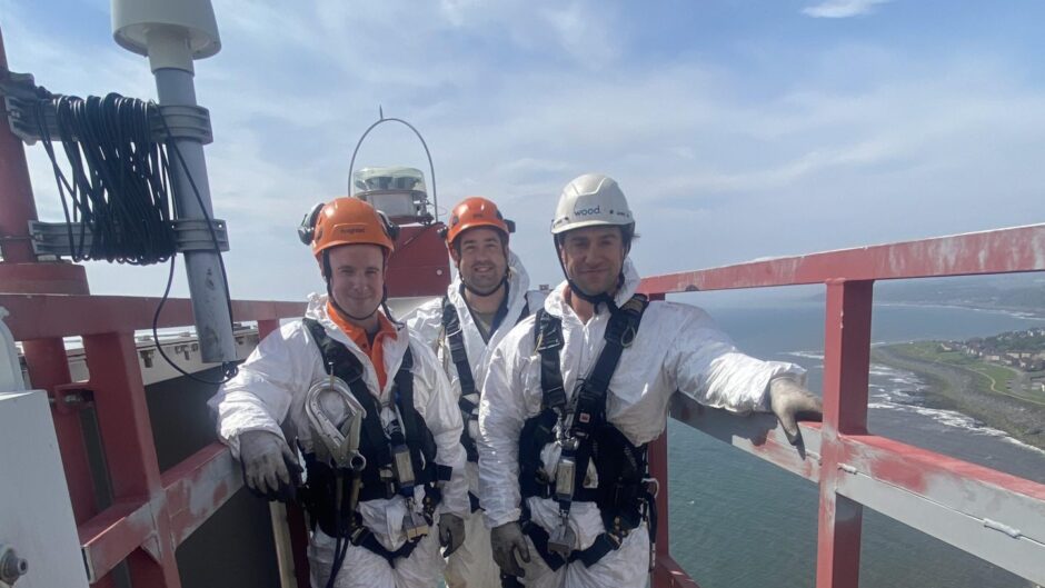 Learners Calvin Stewart, Michael Johnstone and Niall Gibb on top of a wind turbine during the WTT pilot. Image: ECITB