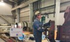 man handling a large piece of equipment