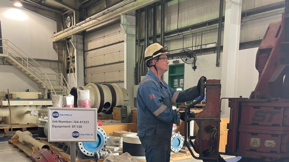 man handling a large piece of equipment