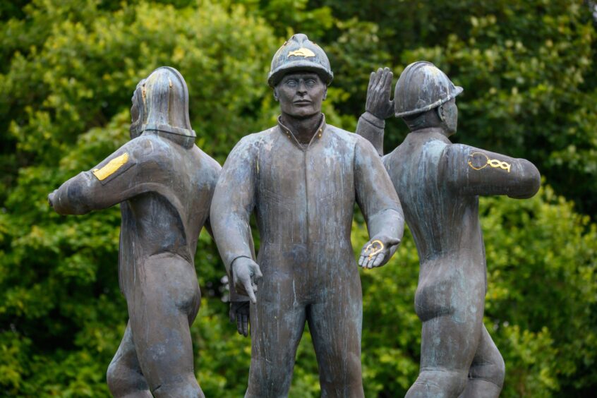 Close-up of the North Sea Memorial statue in Aberdeen’s Hazlehead Park, commemorating victims of the Piper Alpha disaster.