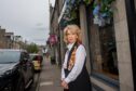 Jeanette Forbes stands outside her Thistle Street restaurant, Mediterranean.
