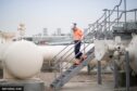 Woman on steps at Bacton gas terminal