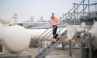 Woman on steps at Bacton gas terminal