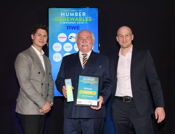 Kurt with Humber Renewables Award host Ben Hanlin, left, and Andy Sykes of sponsor Siemens Gamesa, when he was named Renewables Champion at Humber Renewables Awards 2023.
