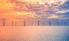 Offshore windfarm at sunset.