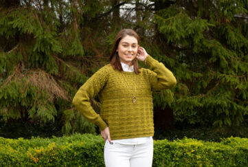 Model wearing knitted gansey, April 16 preview