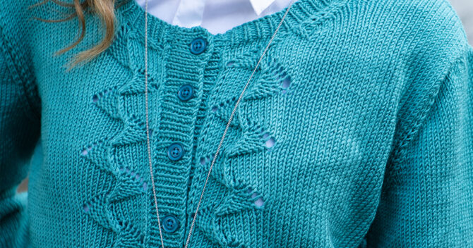 Knitted cardigan button and collar close up in aquamarine