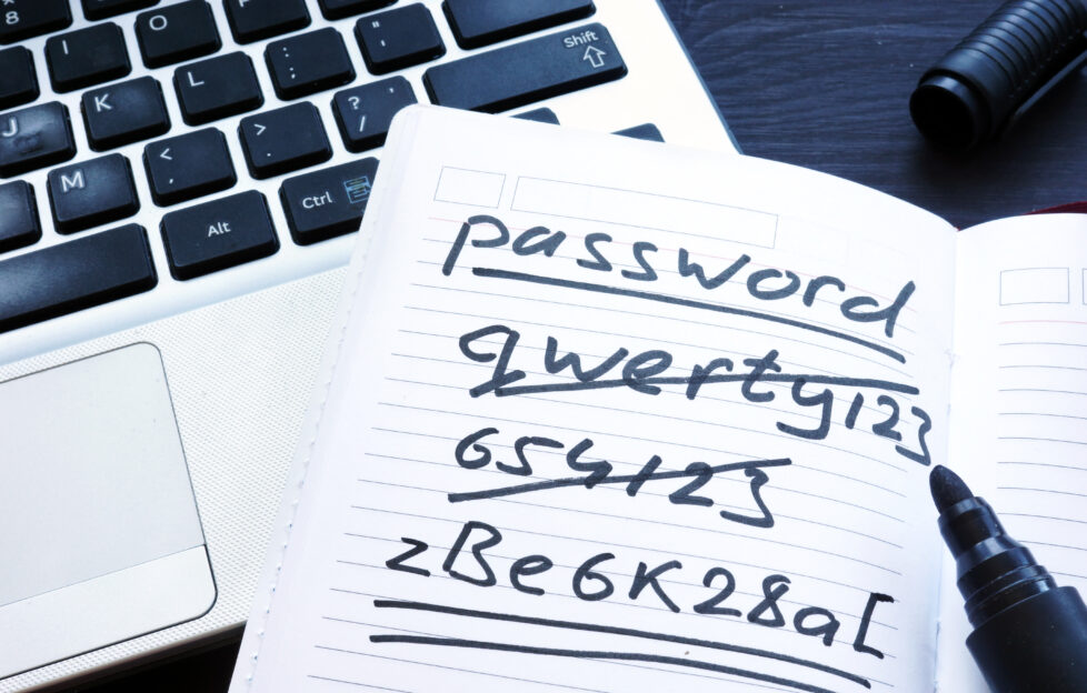 Written bad passwords on a laptop