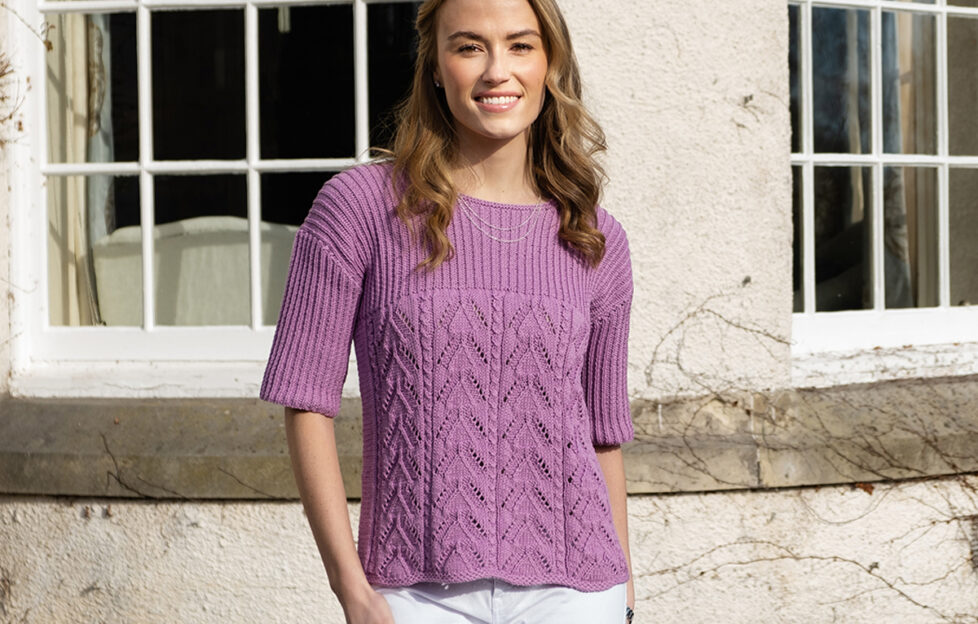 Model wearing mauve knitted lace and rib top