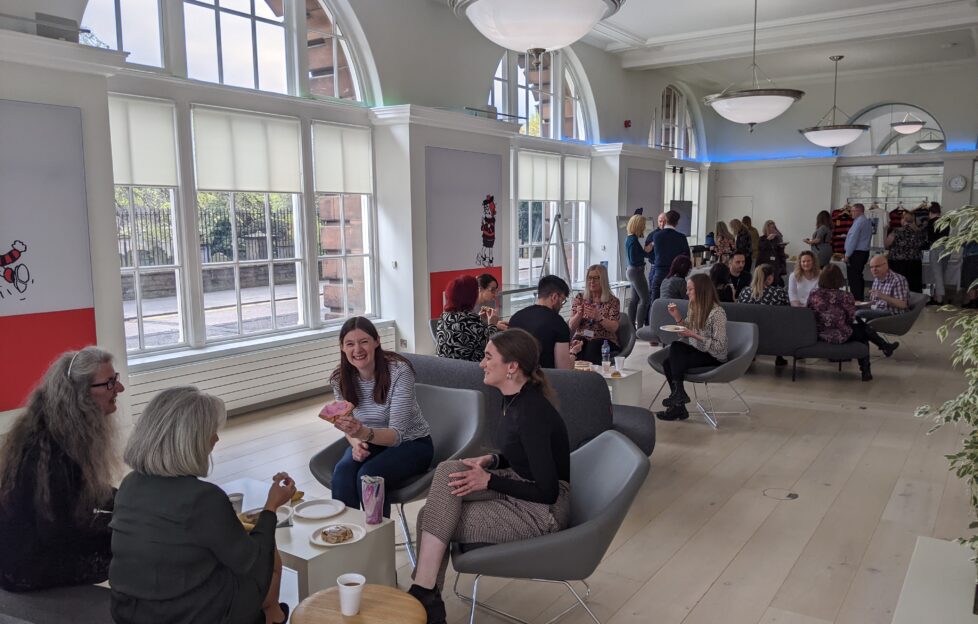 Staff sitting casually around office