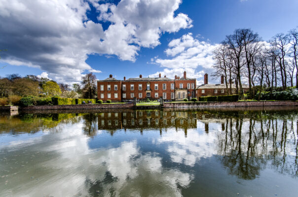 Dunham Messey Hall National Trust Site, Greater Manchester building and sky reflected in lake water