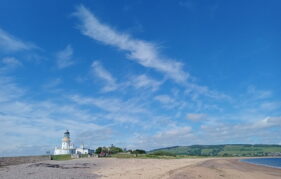 Blue skies view of Chanonry Point lighthouse in the Black Isle, Scotland