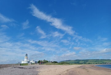 Blue skies view of Chanonry Point lighthouse in the Black Isle, Scotland