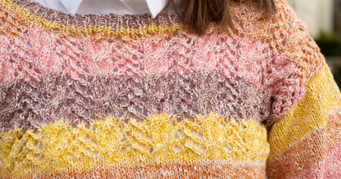 knitting a striped sweater close up knitting pattern, pink purple and yellow stripes