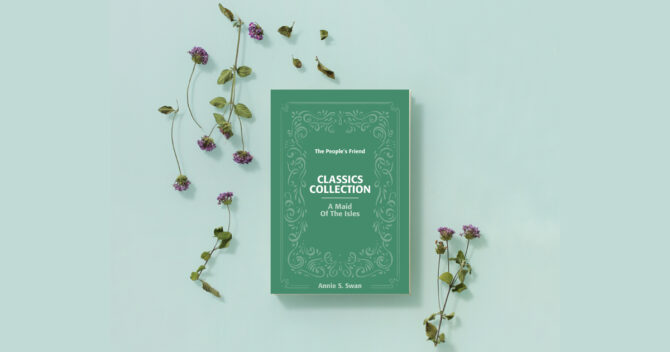 A Maid of the Isles by Annie S. Swan Classics Collection paperback cover flatlay with flowers