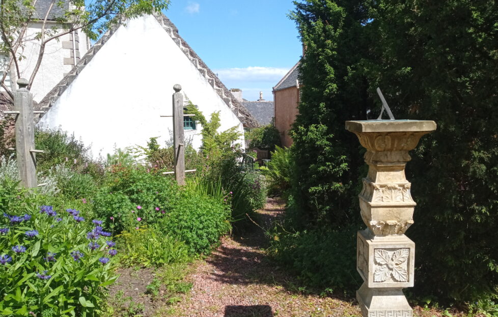 View of Hugh Miller's Cottage in the Black Isle on a sunny day with blue skies