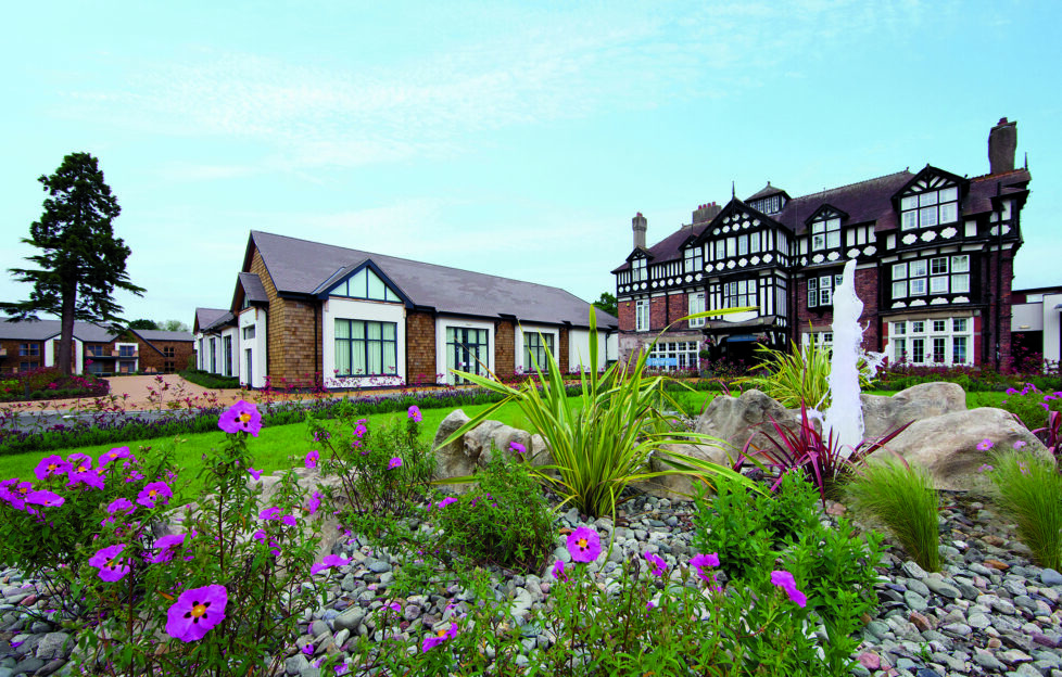 Warner Holiday Alvaston Hall Hotel, Cheshire, view of building exterior with flowering garden in foreground