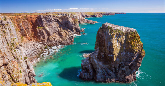 Cliffs and bright blue sea, rock stack on the Pembrokeshire Coast National Park