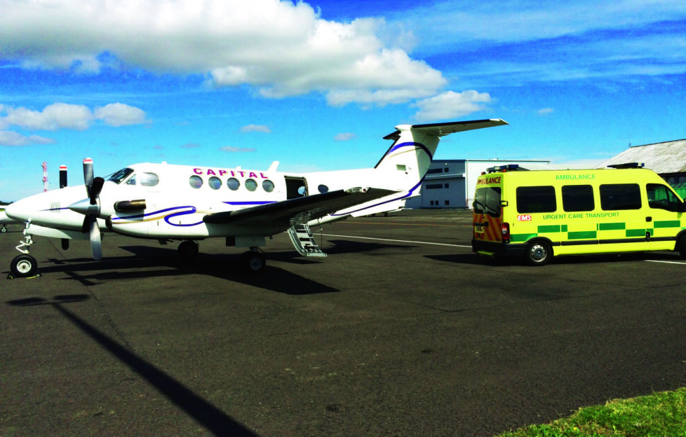 Air ambulance and motor ambulance on plane runway